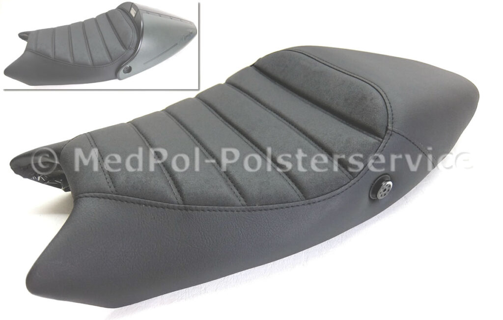 Monster Kompletter Neubezug in Nubuck und Matt mit Komfortpolsterung incl. Gel-Aktivmatte, Sitzbogen ausgefräst, Schräglage gerade gestellt und der Abdeckung angepasst. Quersteppung mit doppelter Ziernaht in Schwarz